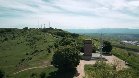 Flying around the look-out tower on Gusterita Hill, Sibiu, Romania Stock Footage 275678405