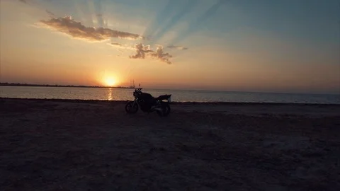 Flying around Motorcycle during sunset Stock Footage 90028791