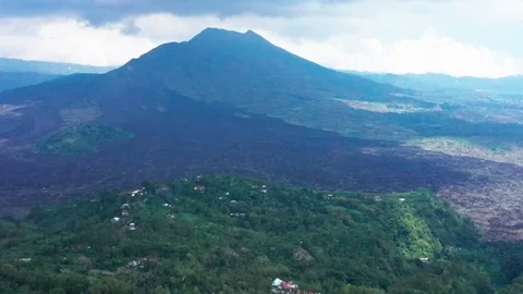 Flying around Mount Batur, an active Volcano in Bali Indonesia days after Stock Footage 102532515