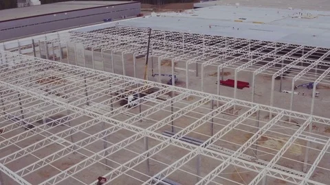 Flying around a new build warehouse building Stock Footage 83611053