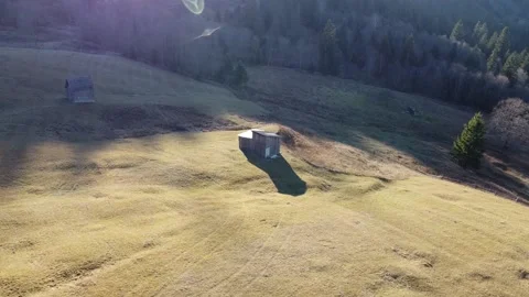 Flying around an old barn in a high-altitude pasture Stock Footage 167244171