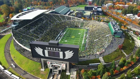 Flying around the Oregon Ducks Autzen Stadium revealing the field Stock-Footage 164477486