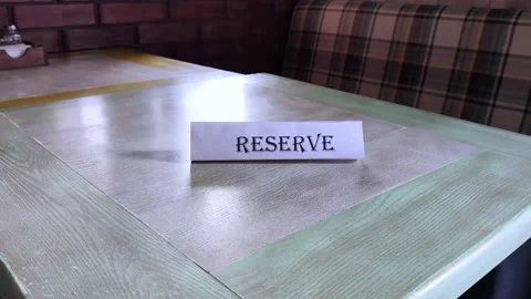 The flying around the plate is reserved, which stands on the wooden table in the Stock Footage 152233623
