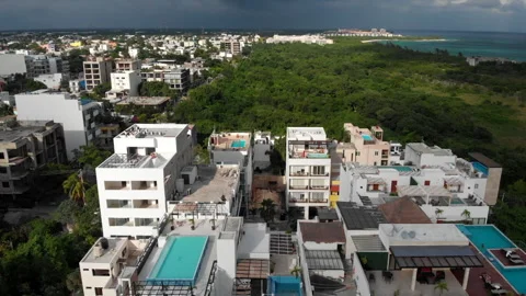 Flying Around a Rooftop pool in a Small Caribbean Town before storm Stock Footage 166406136
