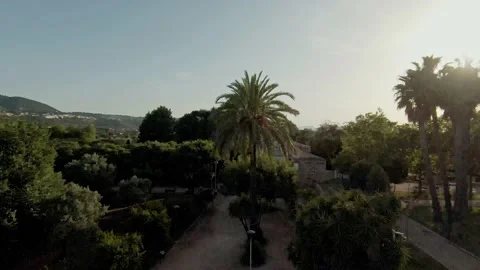 Flying around a round abandoned building in Torrecremada park late afternoon Stock Footage