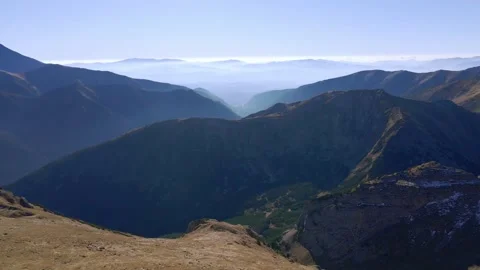 Flying around the rounded peak of Ciemniak, with a far-reaching views  Stock Footage 170294525