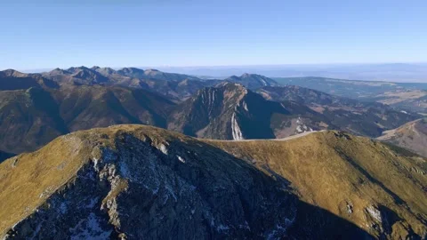 Flying around the rounded peak of Ciemniak, with a far-reaching views over th Stock Footage 170294708