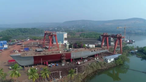 Flying around shipyard on the river, vessel housing on slipway. Aerial view. Stock Footage 85508274
