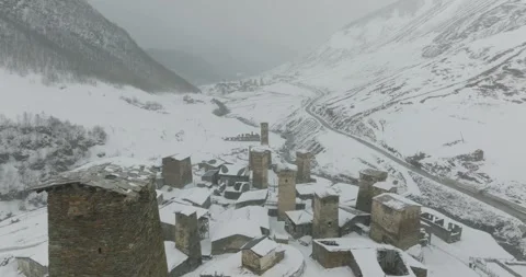 Flying Around Snow Covered Ushguli Village Vídeo Stock 339283951