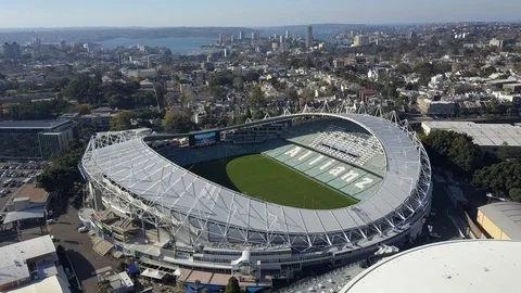 Flying around a stadium with a city in the background Stock Footage 106592103