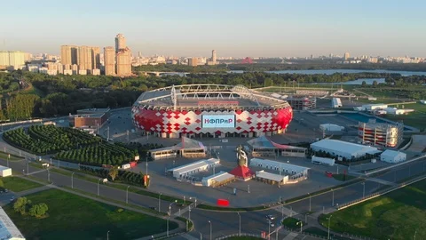 Flying around the Stadium Discovery Arena. Picturesque cityscape with the park Stock Footage 90422453