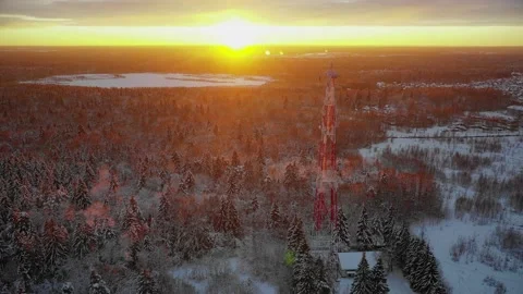 Flying around the telecommunications tower at sunset Stock Footage