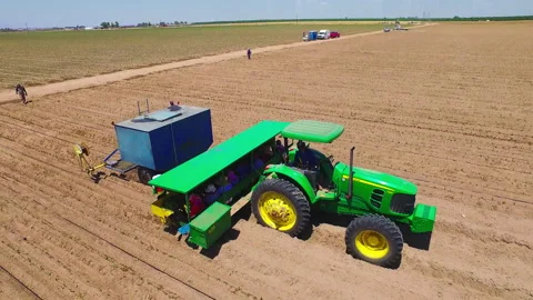 Flying around a tractor 動画素材 203968994