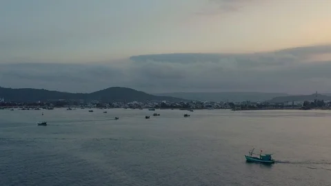 Flying around two boats floating on calm sea water diverging with island backgro Stock Footage 124106832