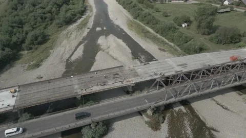 Flying around two bridges. Building new bridge next to the old. Stock Footage 138199079