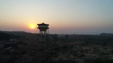 Flying around a water tower in the evening. Aerial view. Stock-Footage 85520328