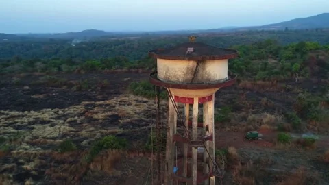 Flying around a water tower in a small Indian village. Aerial view. Stock-Footage 85513562