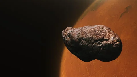 Flying asteroid towards the planet Mars Video stock 242784635
