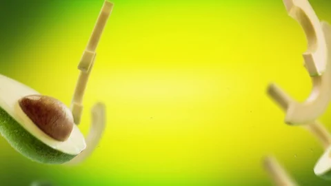 Flying of Avocado and Slices in Lime Green Background Stock Footage 123497832