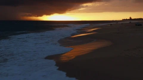 Flying away along sunset with waves and shoreline, aerial above Kauai, Hawaii Stock Footage 108474224