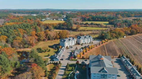 Flying Away from Apartment Complex to Reveal Fall Foliage Vídeo Stock 166863620