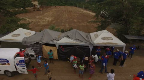 Flying Away from Relief Distribution Site Stock Footage 63604692