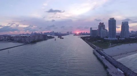 Flying away from the sunset through Miami Inlet Stock Footage 51554556
