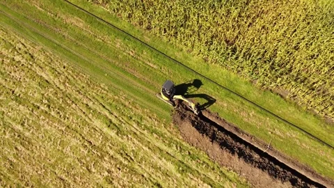 Flying away from Working excavator 4k Stock Footage 266299227