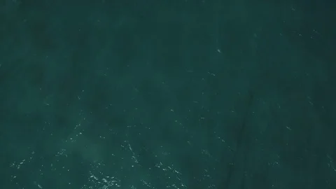 Flying back above white anchored yacht in blue turquoise sea Video stock 86513655
