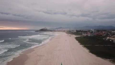 Flying back fast over a beach in Saquarema, Brazil Stock-Footage 124929169