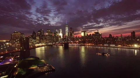 Flying back over Manhattan Bridge dusk view of New York City Stock Footage 68726907