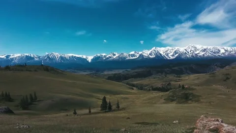 Flying on the background of snowy mountains Stock Footage 162055762
