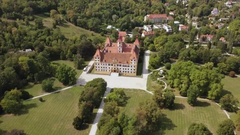 Flying backward from Eggenberg Palace to reveal the surrounding park 스톡 동영상 344643620