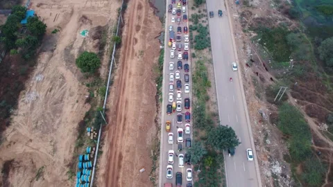Flying backward hyperlapse time lapse drone aerial view of heavy traffic Stock Footage 331257427