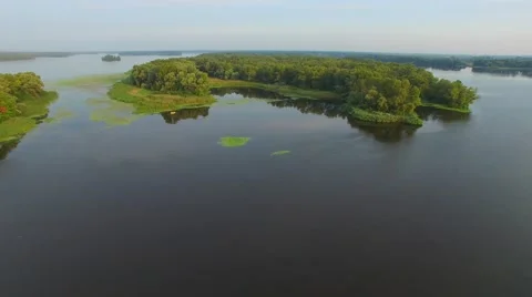 Flying backward over the big river with small islands Video stock 66525759