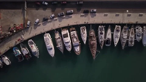 Flying backward over two docks in Marina di Ragusa Stockbeeldmateriaal 74135452