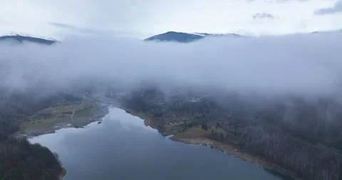 Flying backward reveals the mountain in the background. Foggy autumn morning Stock Footage 174433137