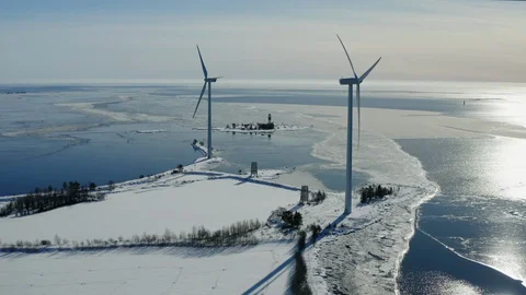 Flying backward from two windmills standing at the coast of Baltic sea Vídeos de archivo 128661121