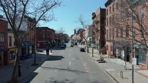 Flying backwards along eerily empty Brooklyn street during Corona quarantine  Stock Footage 127173871