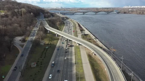 Flying backwards and descending over the interchange with a beautiful view of Stock Footage 219743388