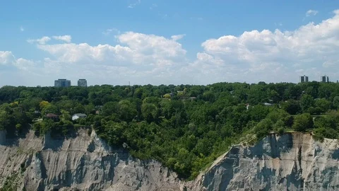 Flying backwards and down from Scarborough bluffs to lake Ontario slow pace Stock Footage 111480244