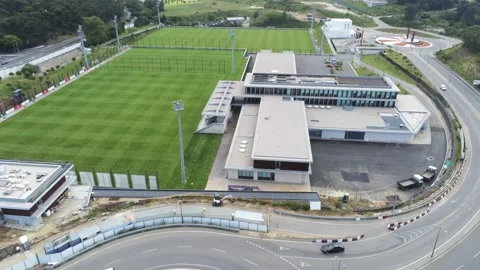 Flying backwards at  Cidade do Futebol ( football city ) over the Stock Footage 172186866