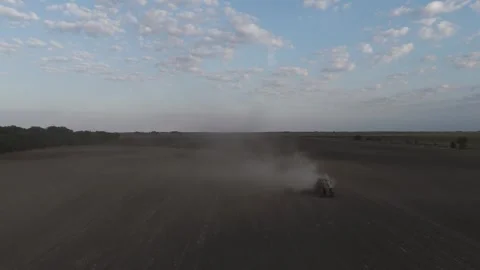 Flying Backwards In Front Of A Tractor In A Field Stock Footage 316713647