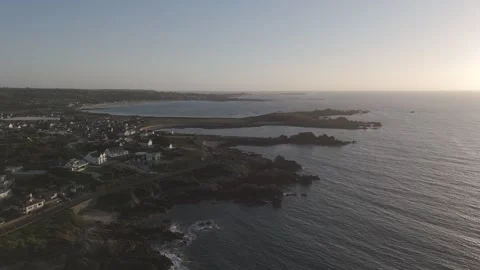 Flying backwards over Cobo Bay, Guernsey Stock Footage 288745277