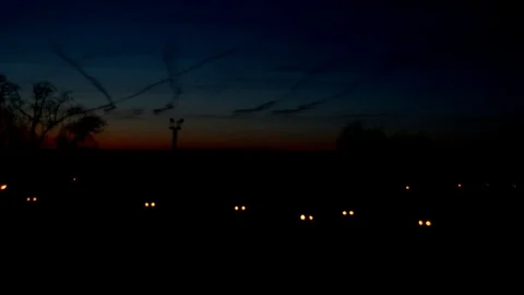 Flying backwards over downtown with cityscape views at sunrise time lapse 動画素材 75036569
