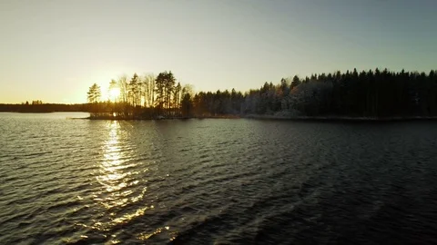 Flying backwards over open lake near water surface, aerial time-lapse. Stock Footage 86151049