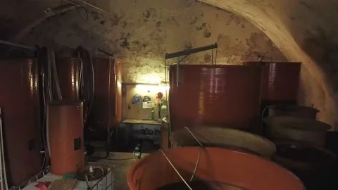 Flying backwards within a cellar over multiple vats, wine production Stock Footage 137398738