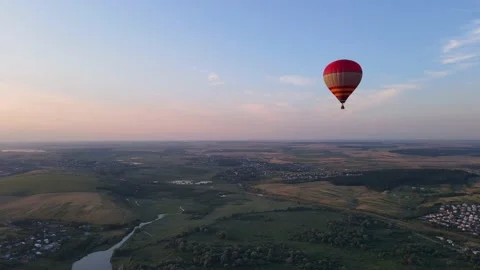 Flying balloon over the forest on background of blue sky Stock Footage 158562567