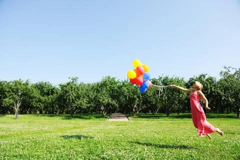 Flying with balloons Stock Photos
