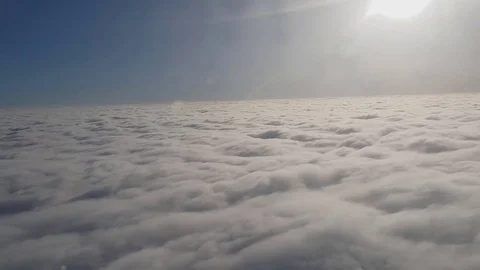 Flying in beautidul clouds in slow motion, soaring above pretty white  clouds Stock Footage 85124447